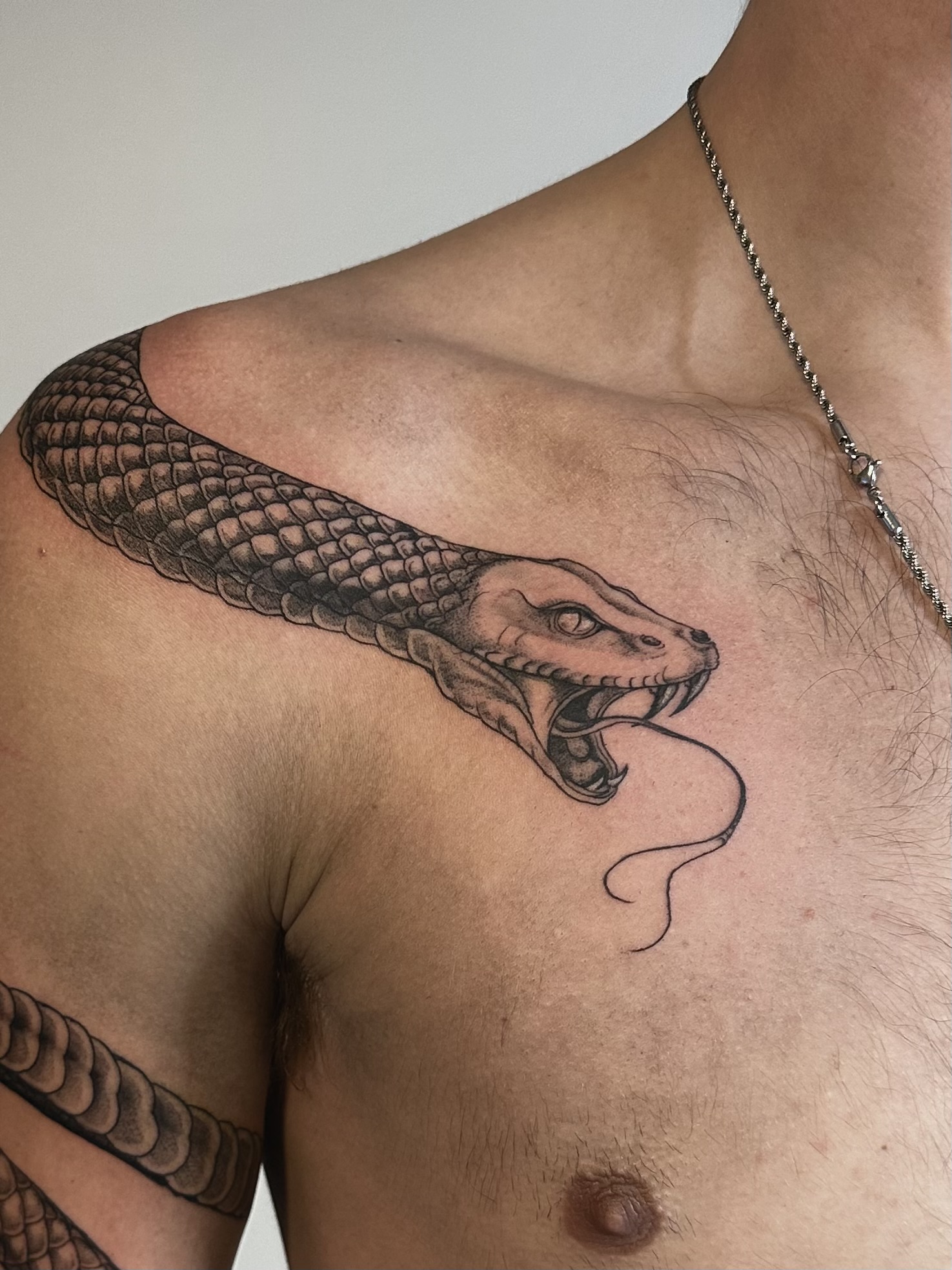 Fine line snake tattoo by Mia — Gold Scarab Tattoo Seattle